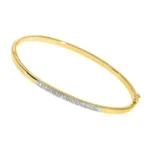 Twelve sapphire yellow gold bangle