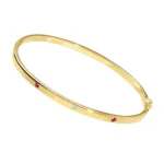 Starrer Armreif mit Rubinen und Topas